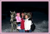 Dashing through the snow in a two-horse open sleigh